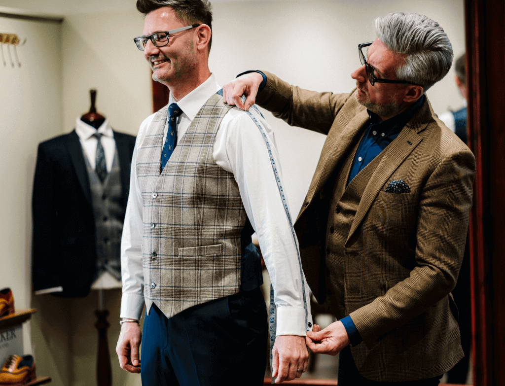 A groom to be has his fitting at Whitfield and Ward.