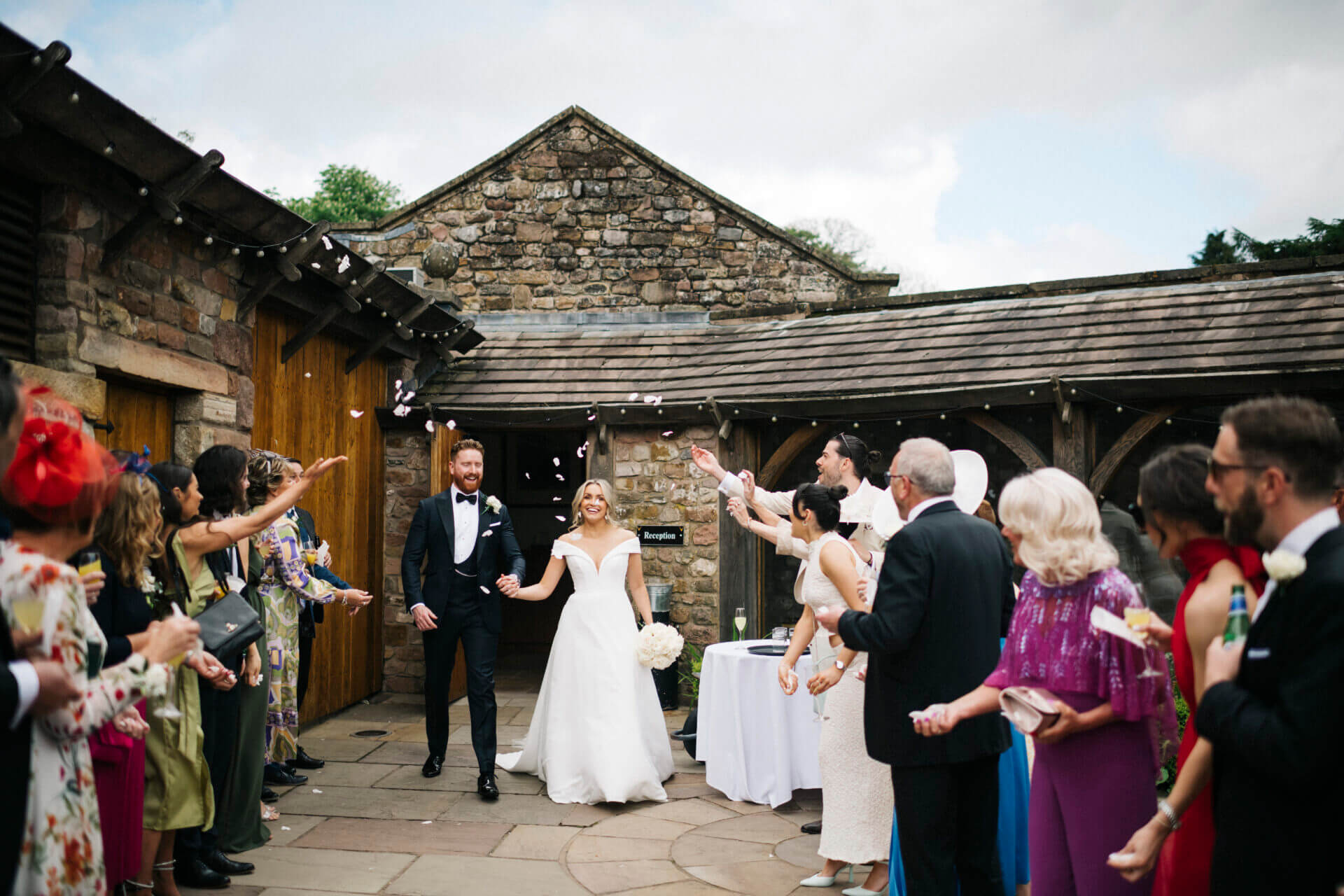 Groom in midnight blue, peak lapel dinner suit